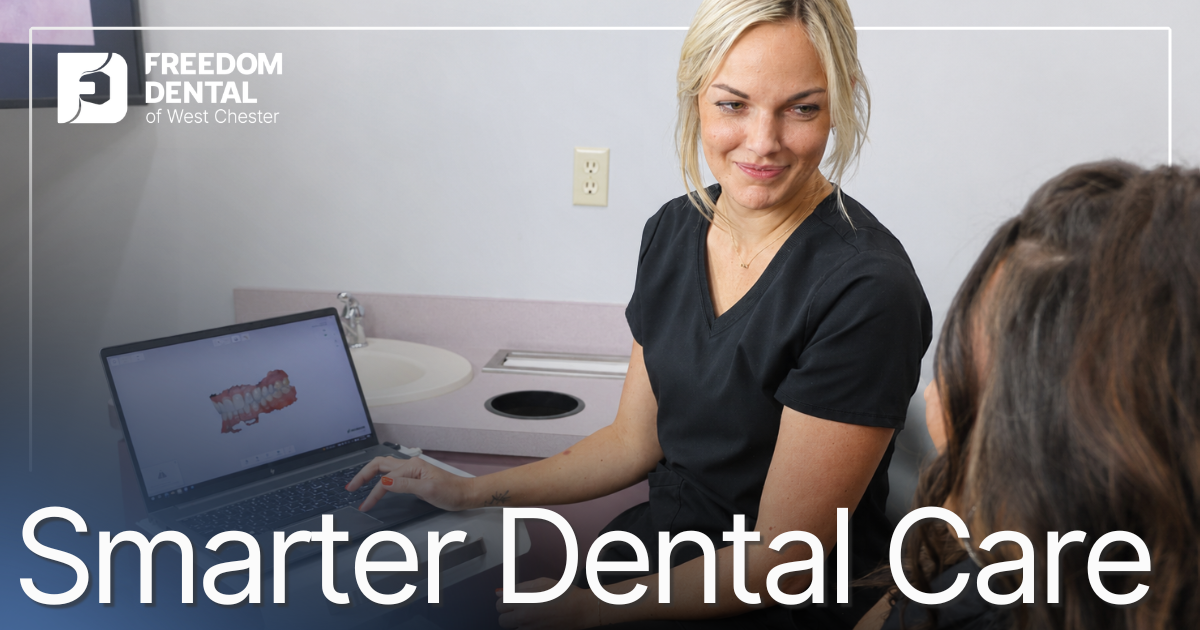 dental assistant showing digital scans to patient