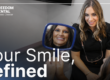 patient smiling looking in the mirror at her smile