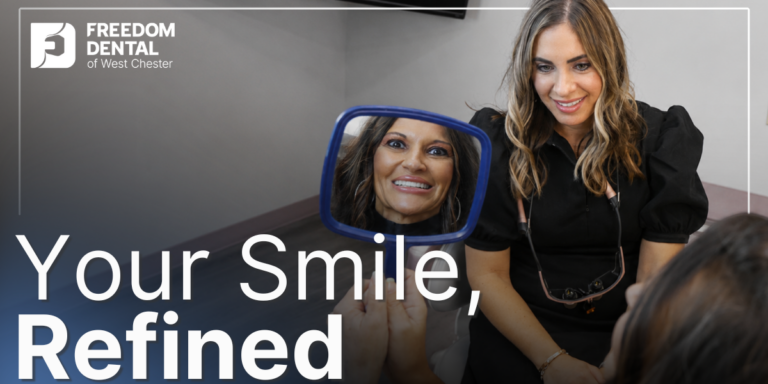 patient smiling looking in the mirror at her smile