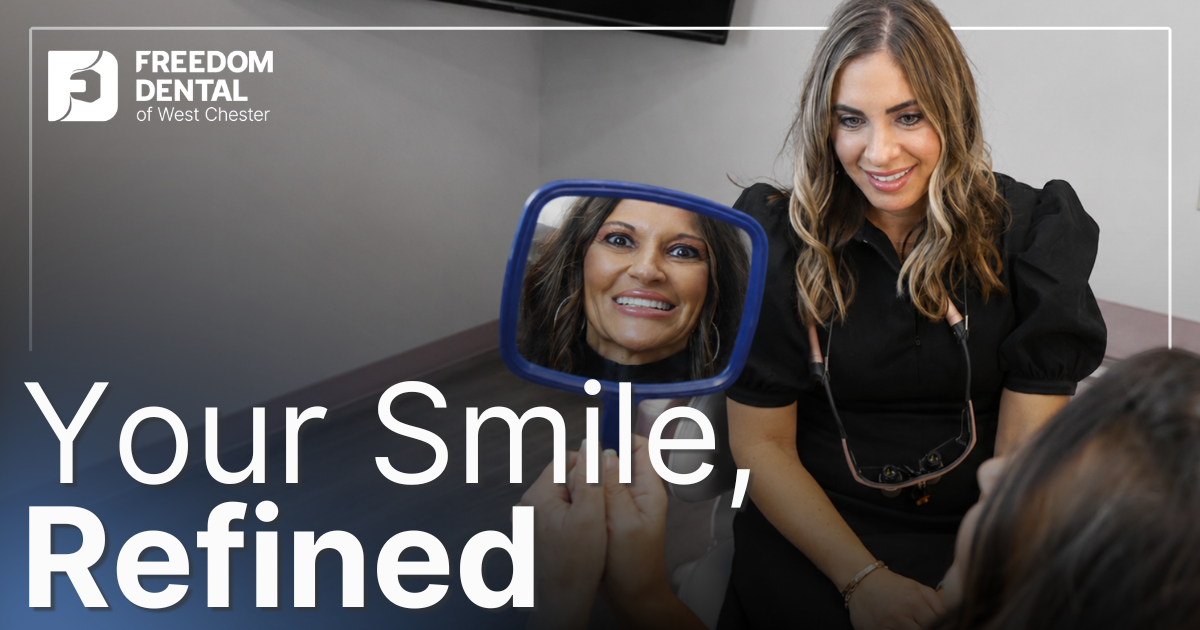 patient smiling looking in the mirror at her smile
